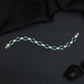 Rhodium Bracelet with Linked Oval Stations and Intricate Borders