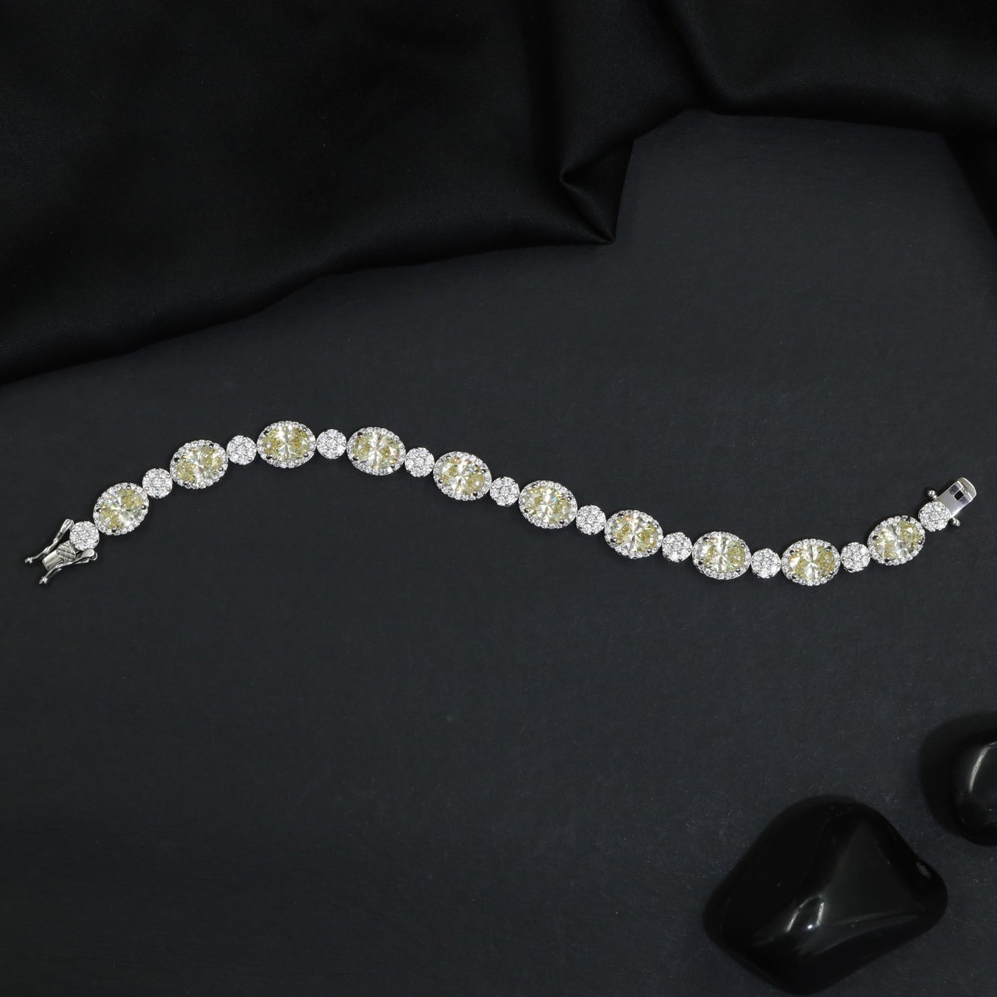 Rhodium Bracelet with Linked Oval Stations and Intricate Borders