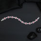 Rhodium Bracelet with Linked Oval Stations and Intricate Borders