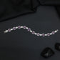 Rhodium Bracelet with Linked Oval Stations and Intricate Borders