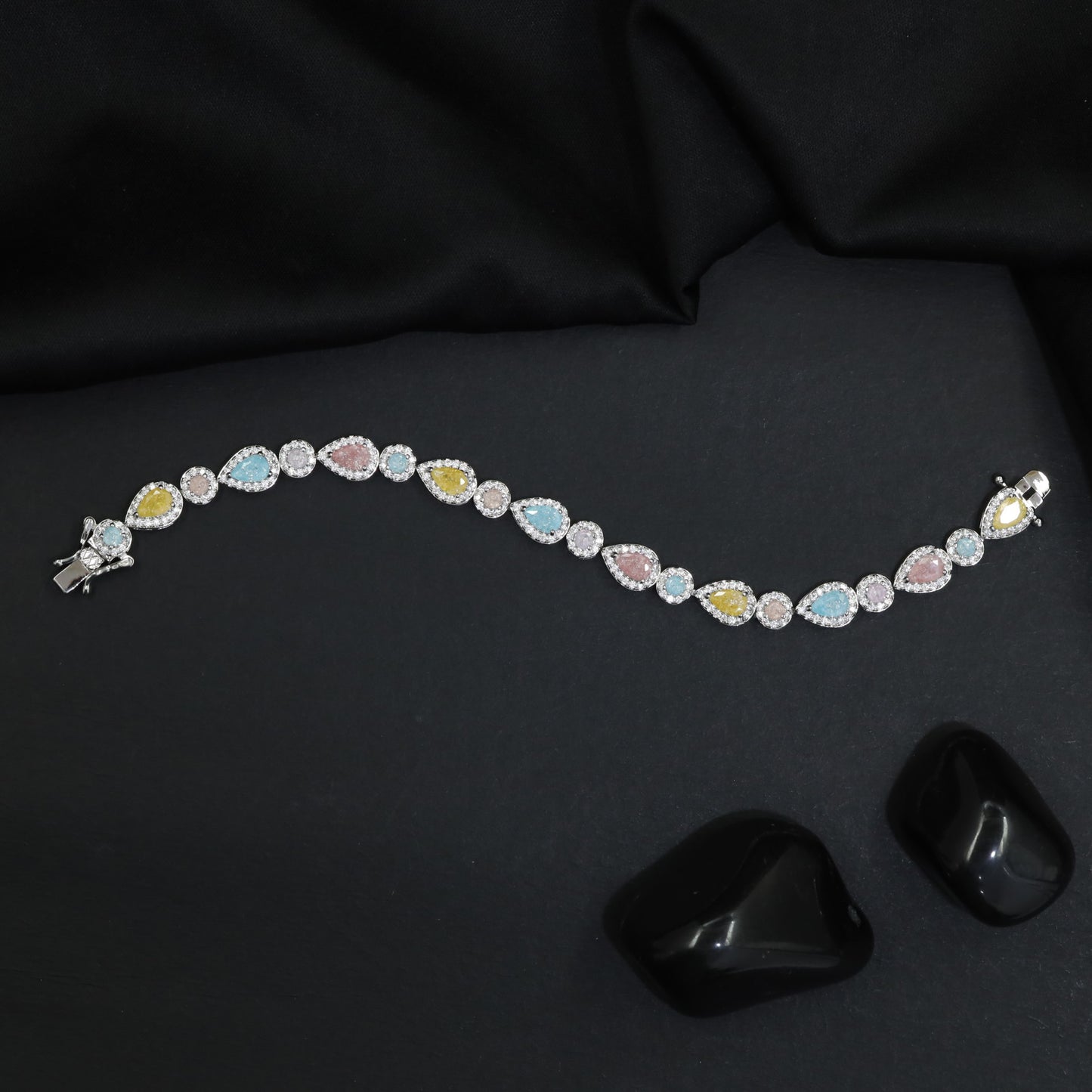 Rhodium Bracelet with Alternating Teardrop Links and Round Connectors