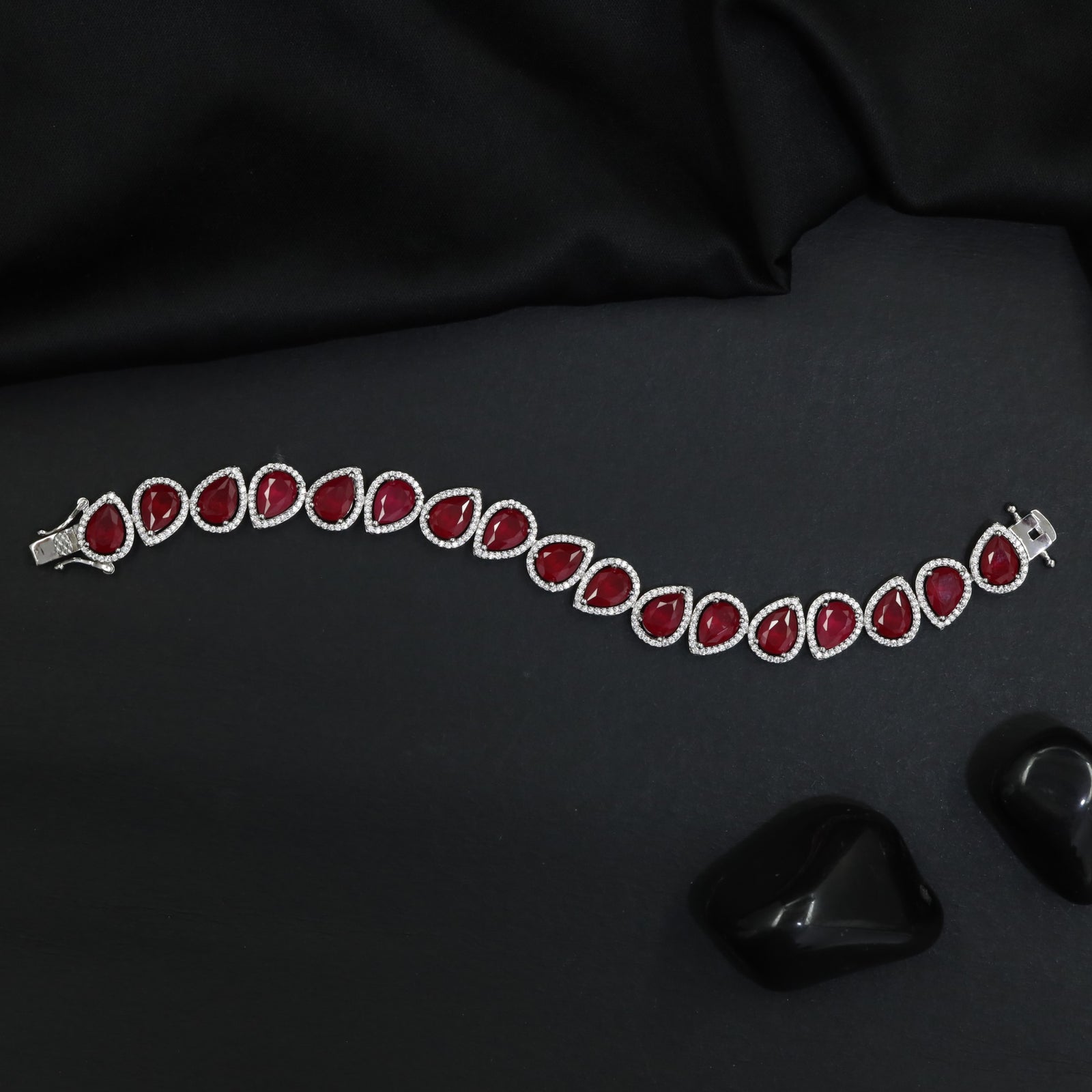 Rhodium Bracelet Featuring Oval Halo Stations and Teardrop Motifs