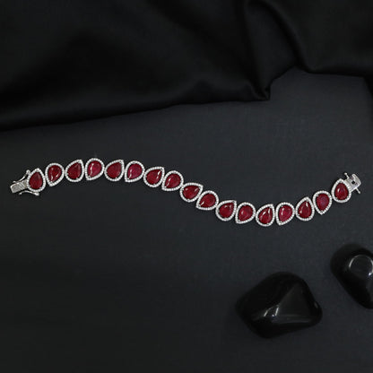 Rhodium Bracelet Featuring Oval Halo Stations and Teardrop Motifs