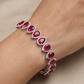 Rhodium Bracelet Featuring Oval Halo Stations and Teardrop Motifs