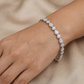 Rhodium Bracelet with Alternating Pear and Round Crystal Motifs