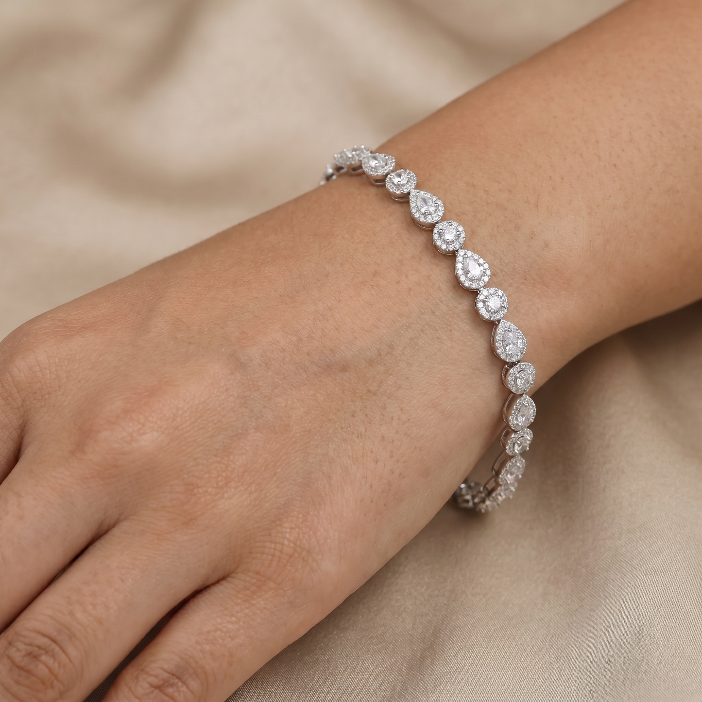 Rhodium Bracelet with Alternating Pear and Round Crystal Motifs