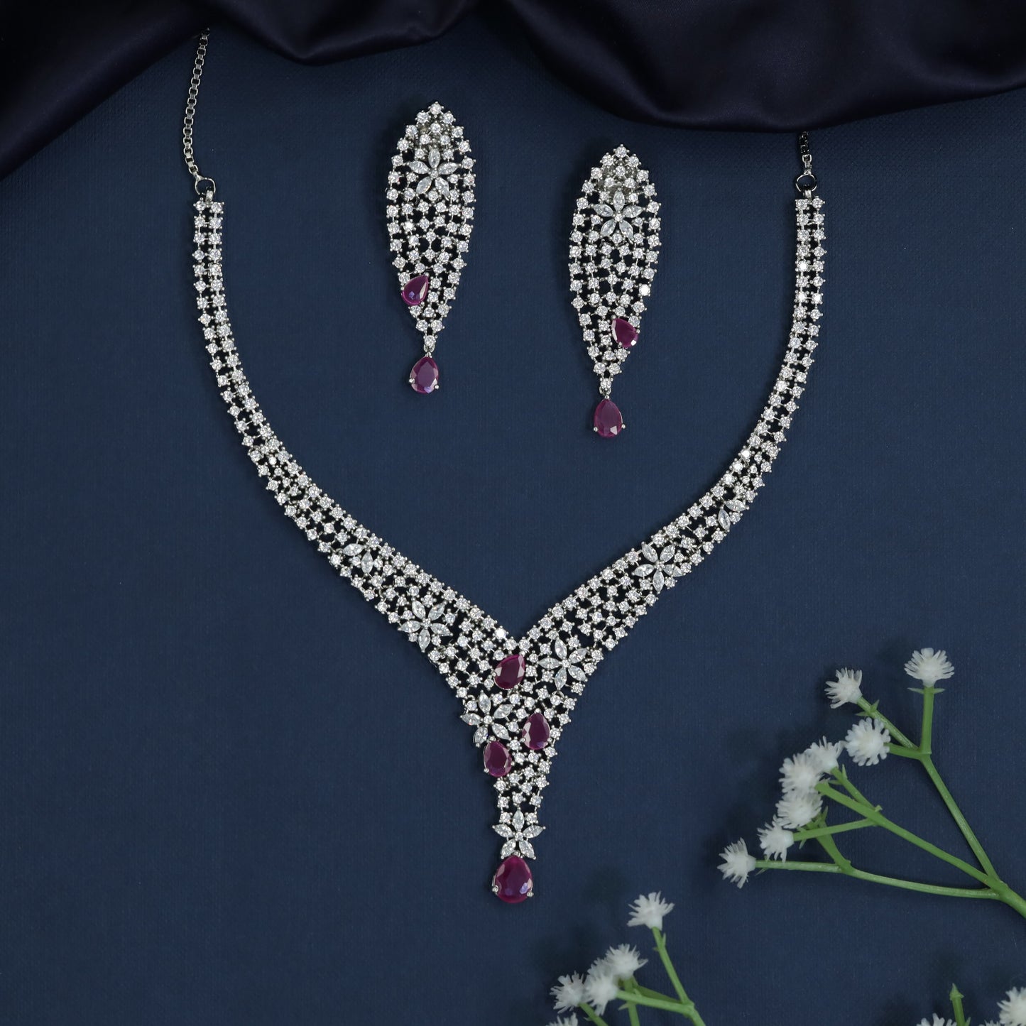 Couture rhodium necklace showcasing structured pendant framework