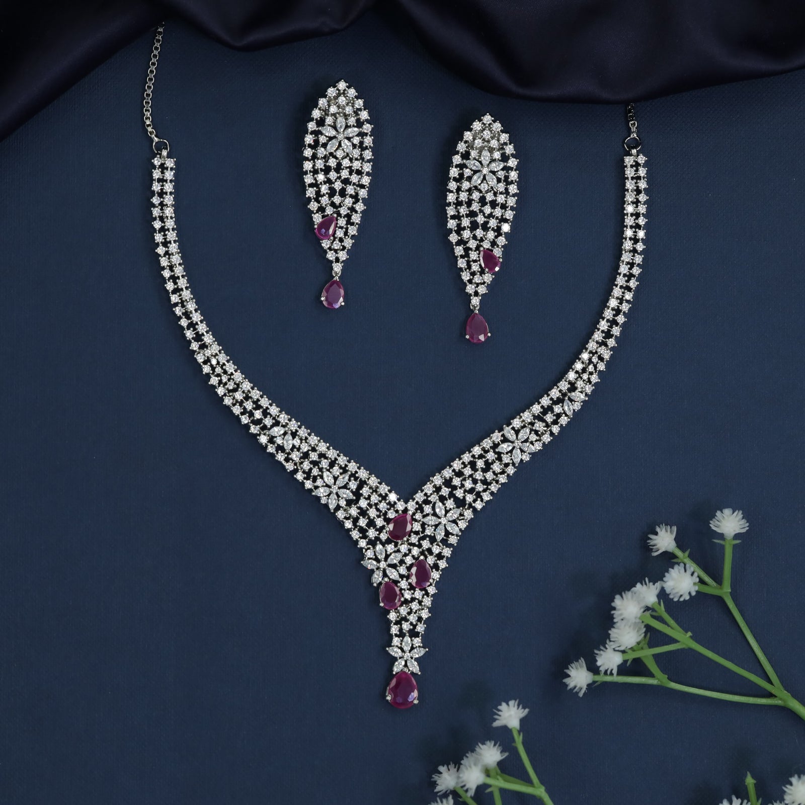 Couture rhodium necklace showcasing structured pendant framework