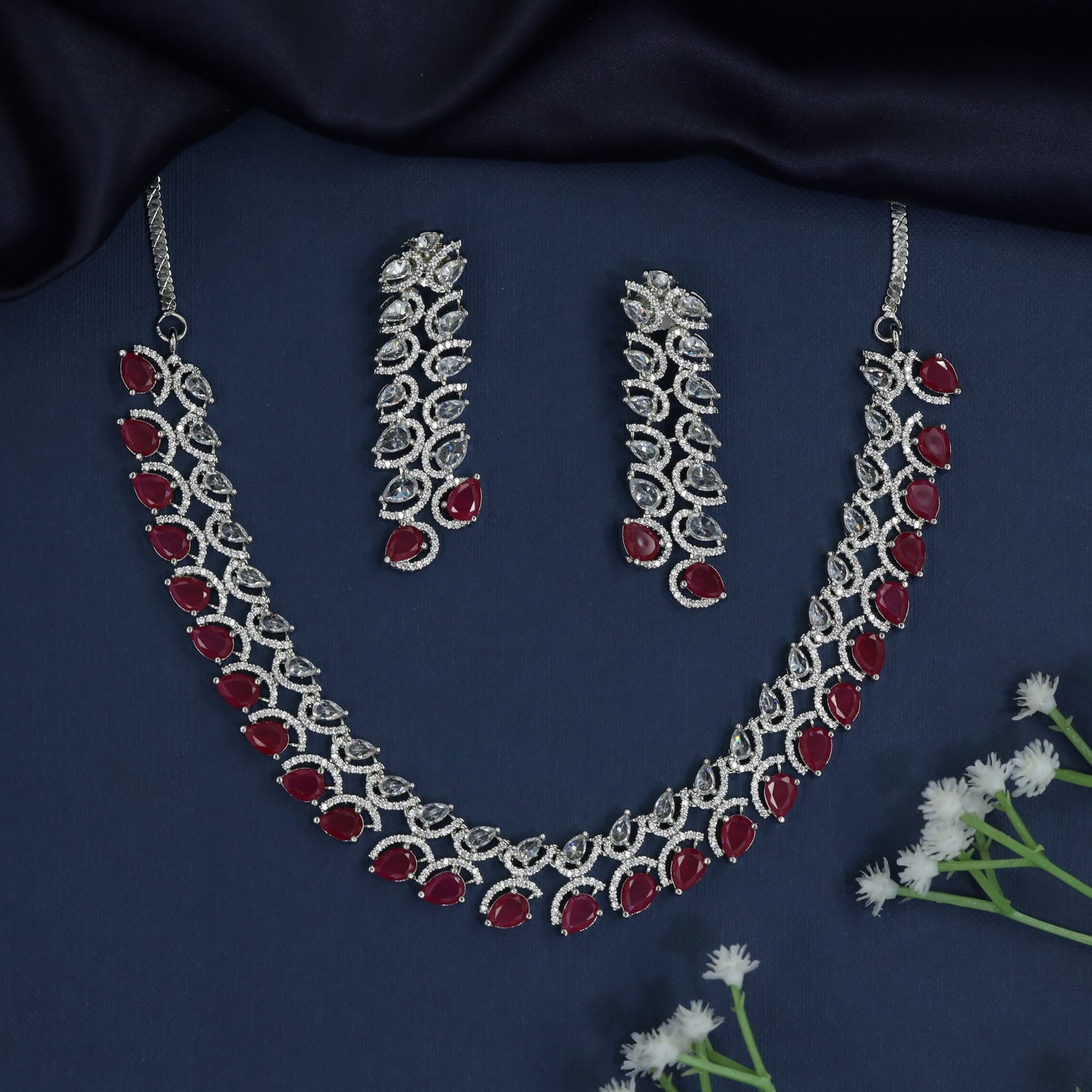 Rhodium necklace with scalloped station arrangement and fringe border