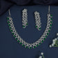 Rhodium necklace with scalloped station arrangement and fringe border