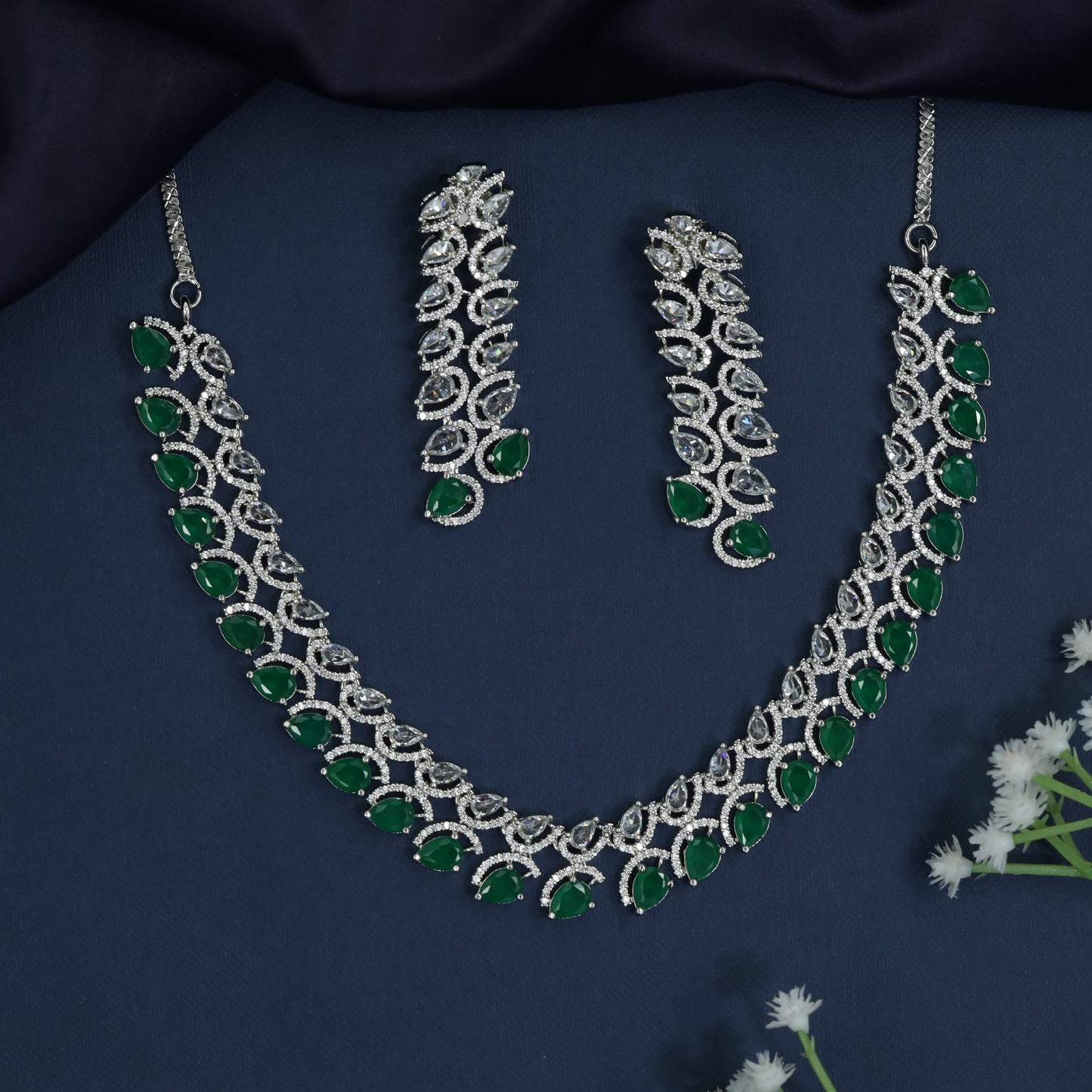 Rhodium necklace with scalloped station arrangement and fringe border