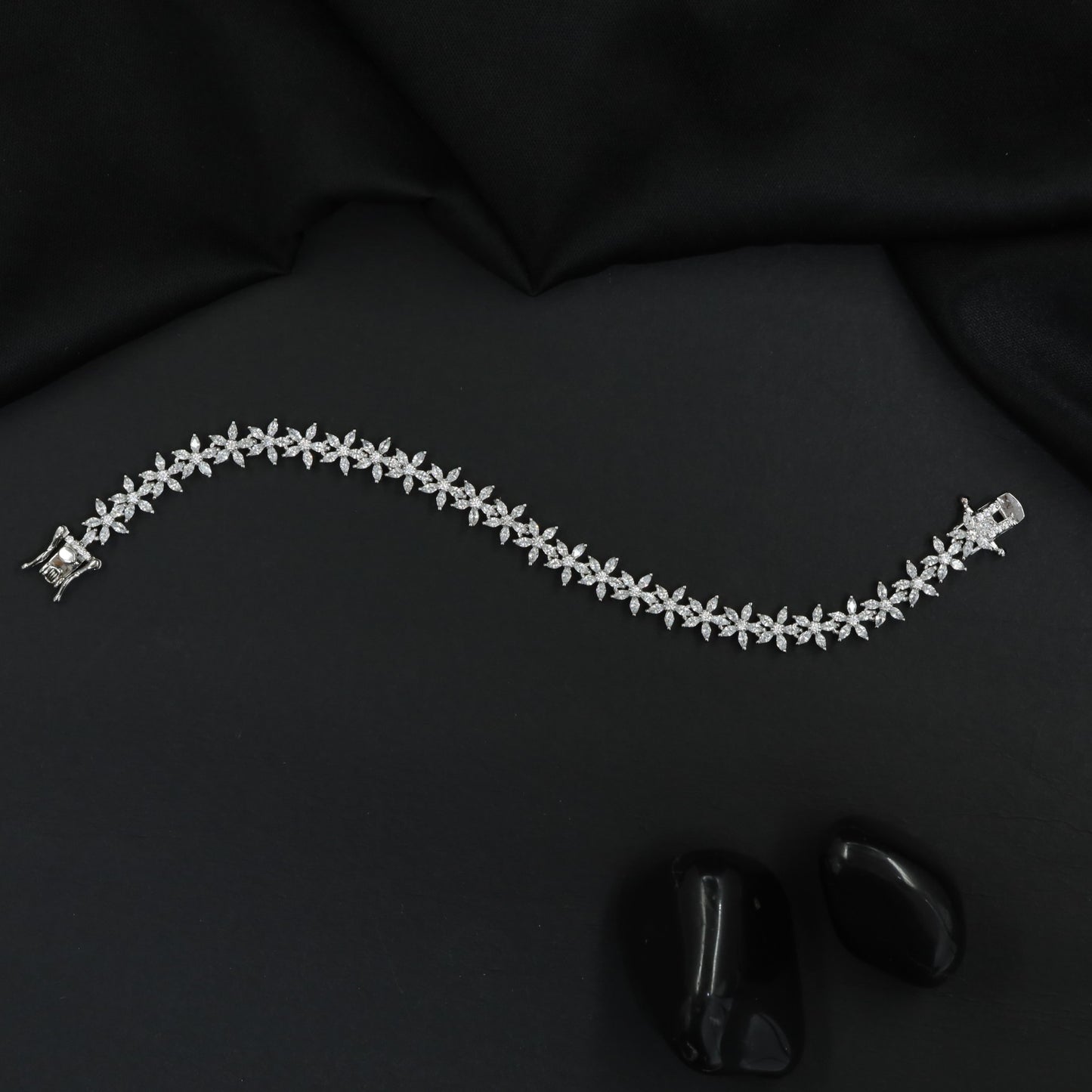 Rhodium Bracelet Featuring Continuous Floral Vine Design