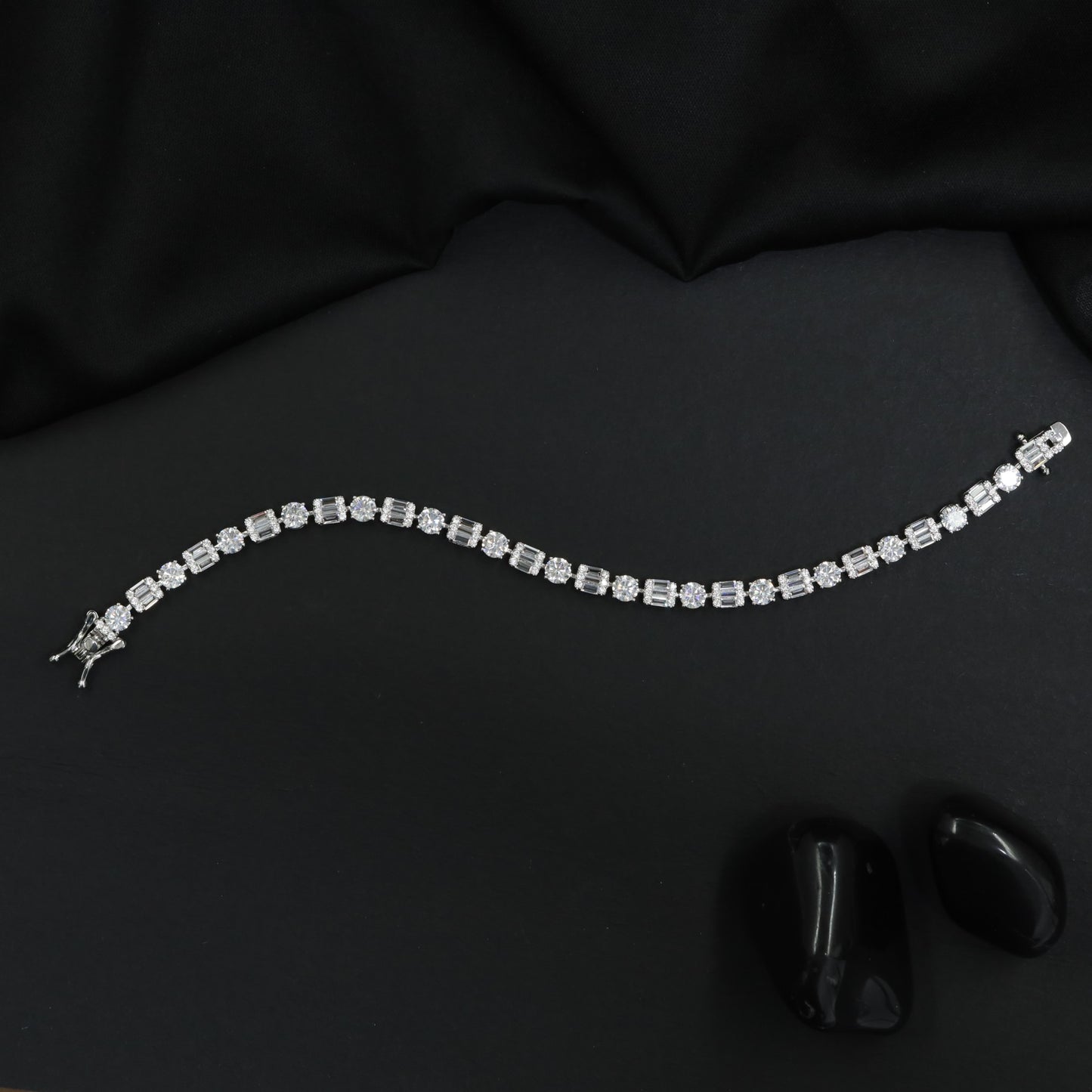 Rhodium Bracelet with Alternating Floral and Geometric Design