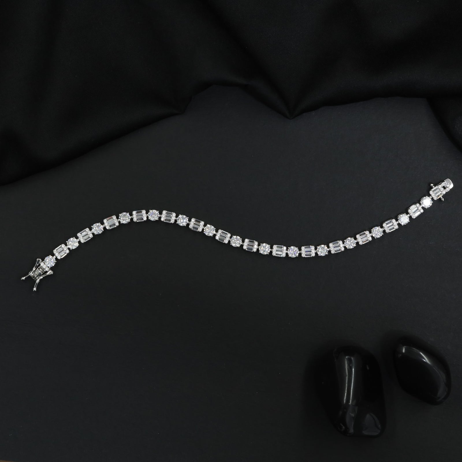 Rhodium Bracelet with Alternating Floral and Geometric Design