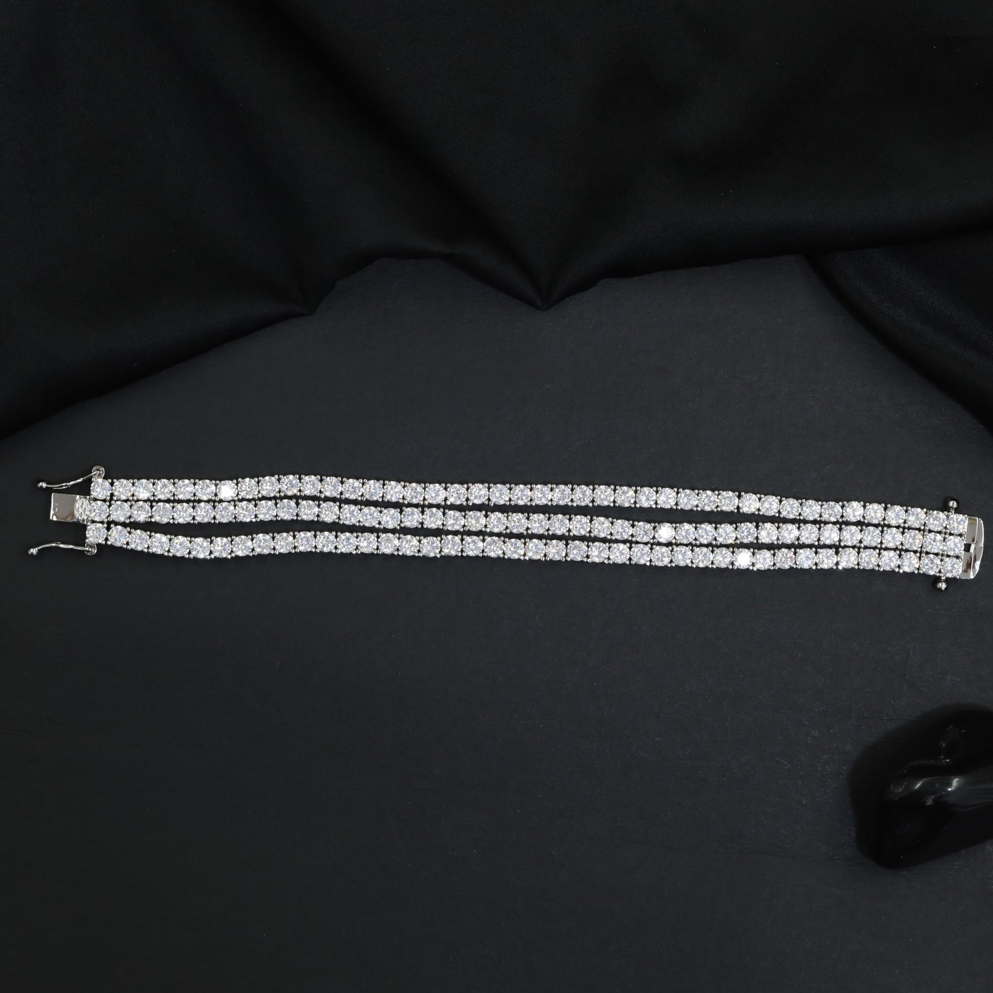 Rhodium Bracelet Featuring Three Strand Floral Clusters
