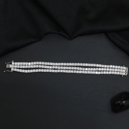 Rhodium Bracelet Featuring Three Strand Floral Clusters