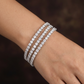 Rhodium Bracelet Featuring Three Strand Floral Clusters