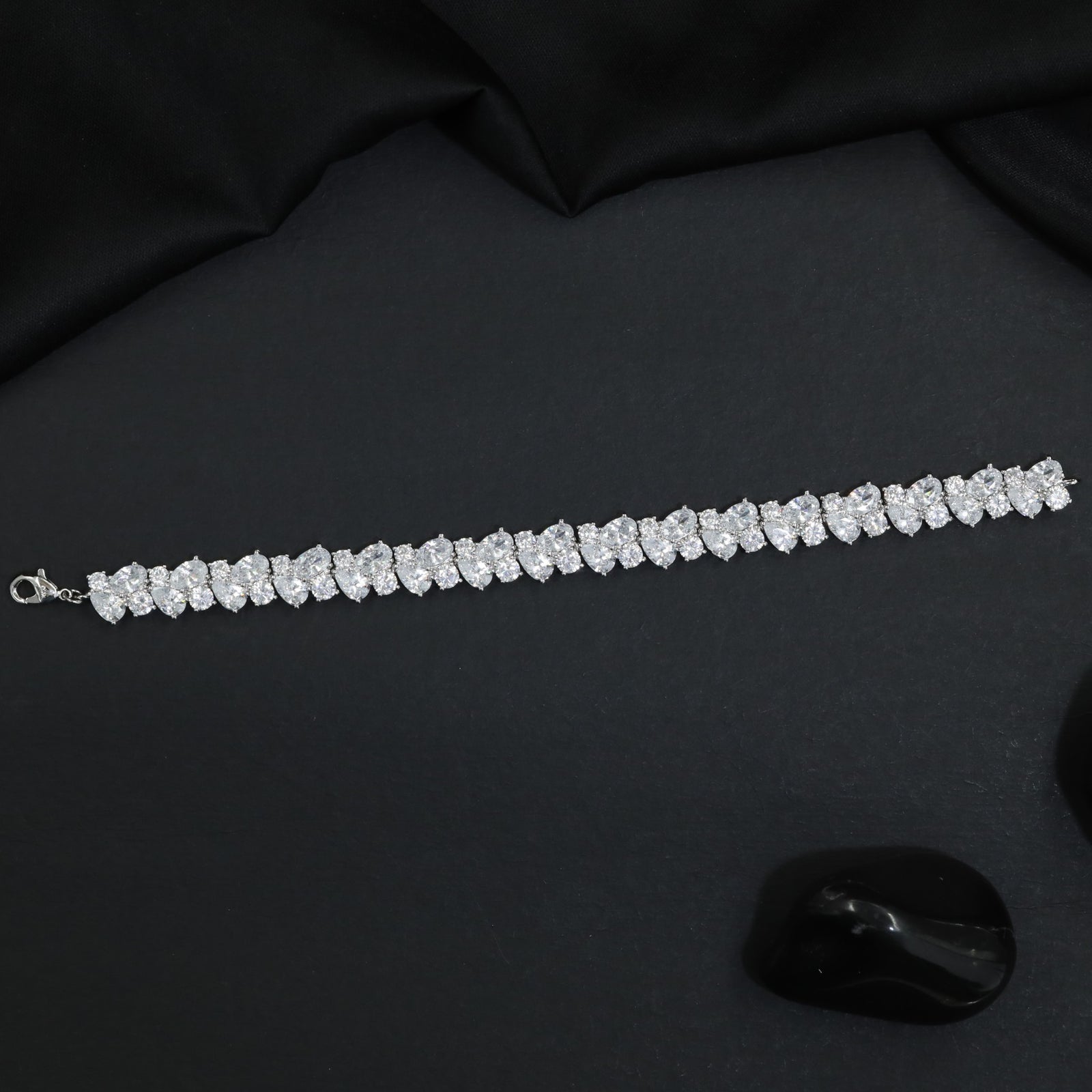 Rhodium Bracelet Showcasing Alternating Pear Clusters