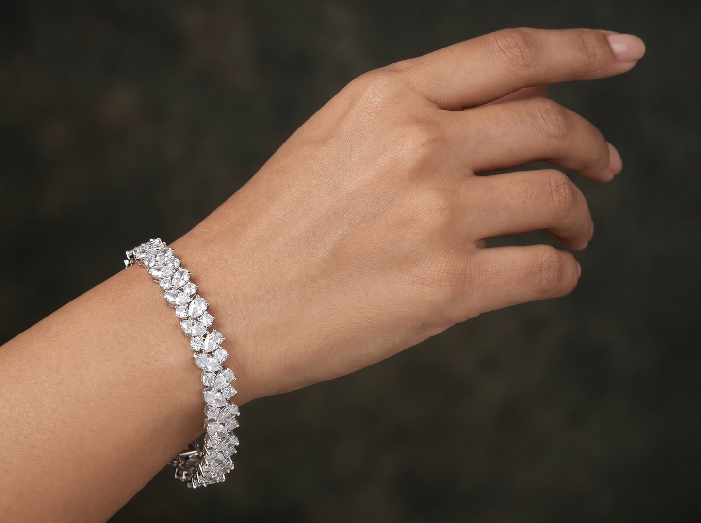Rhodium Bracelet Showcasing Alternating Pear Clusters