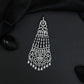 Rhodium Jhumar with Scrollwork Design and Cascading Tassel Strands