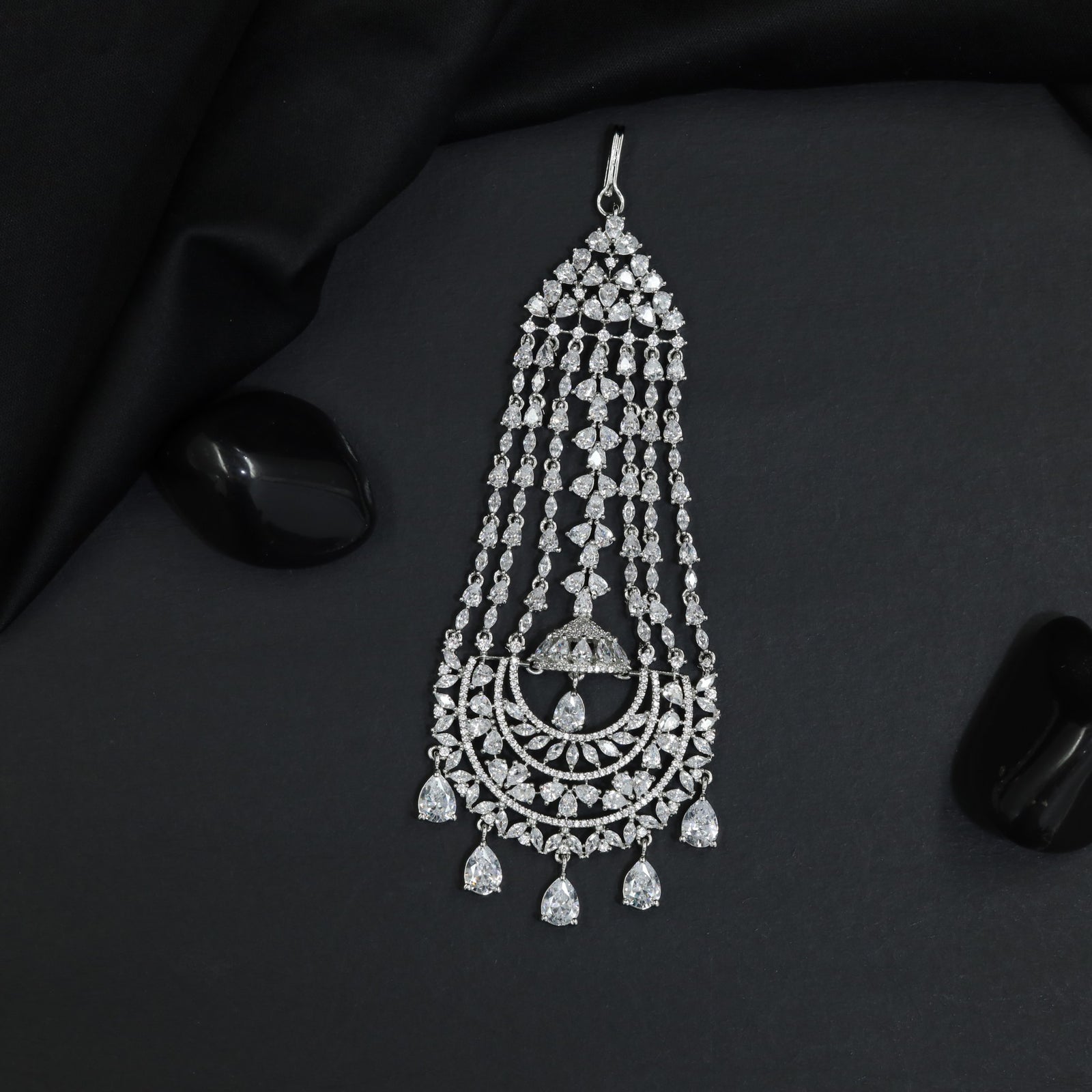 Rhodium Jhumar with Cascading Tassel Strands and Floral Arch Design