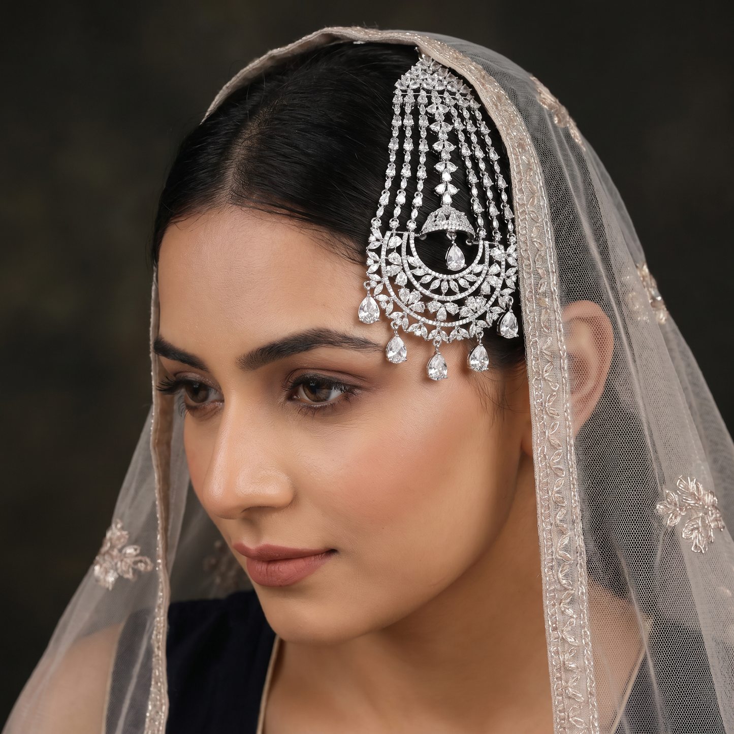 Rhodium Jhumar with Cascading Tassel Strands and Floral Arch Design