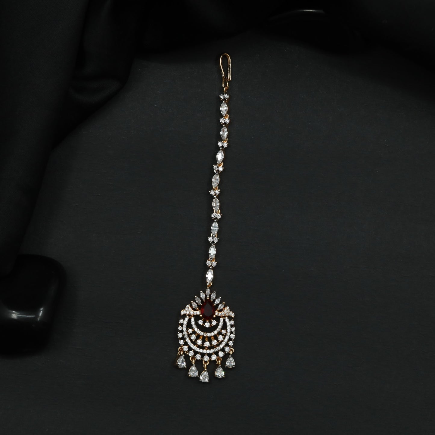 Tikka Featuring Decorative Crescent Pattern and Fringe Elements
