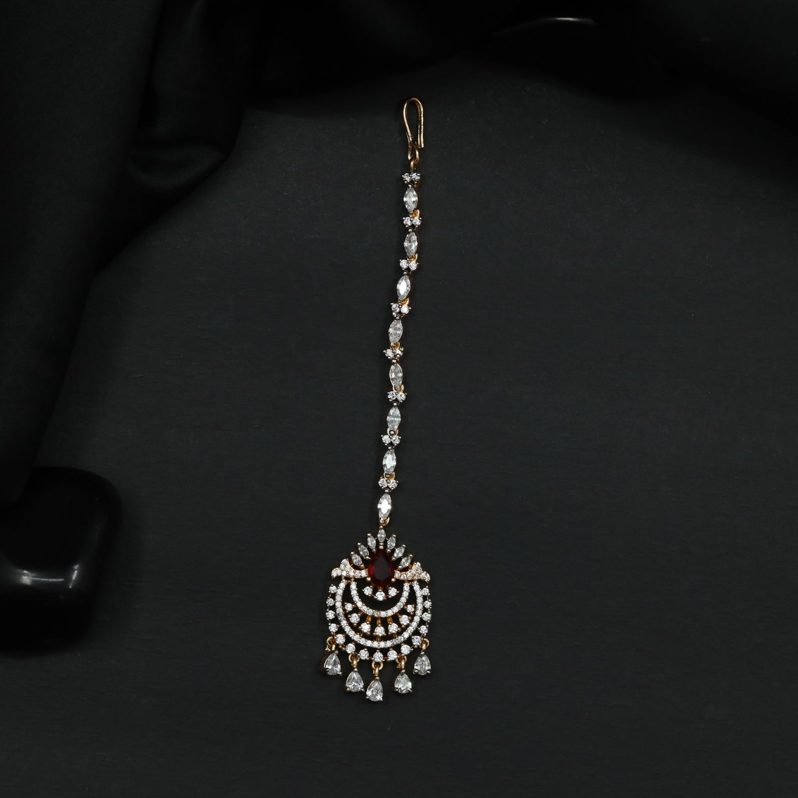 Tikka Featuring Decorative Crescent Pattern and Fringe Elements