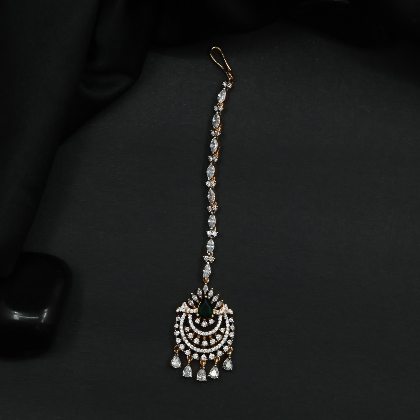 Tikka Featuring Decorative Crescent Pattern and Fringe Elements