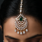 Tikka Featuring Decorative Crescent Pattern and Fringe Elements