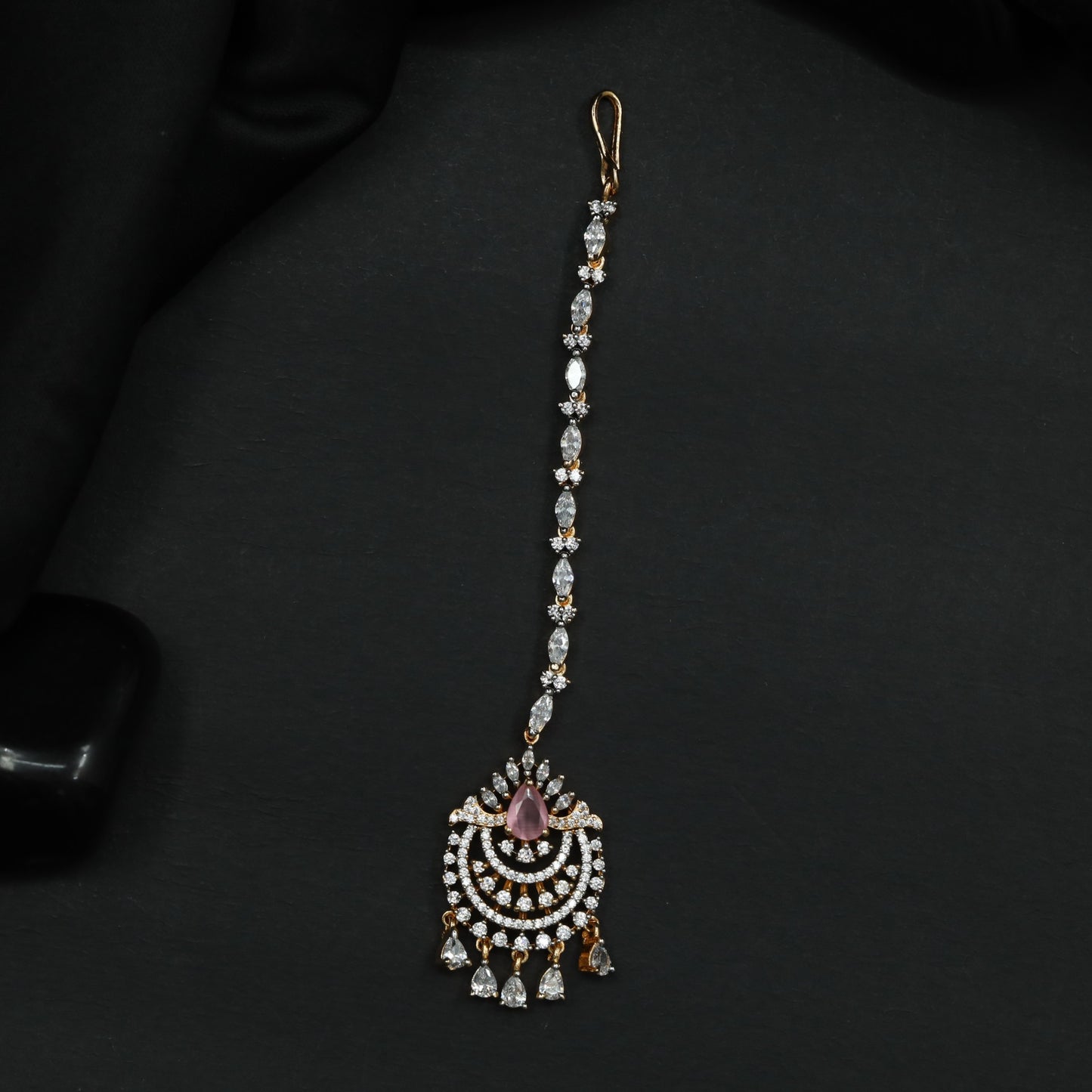Tikka Featuring Decorative Crescent Pattern and Fringe Elements