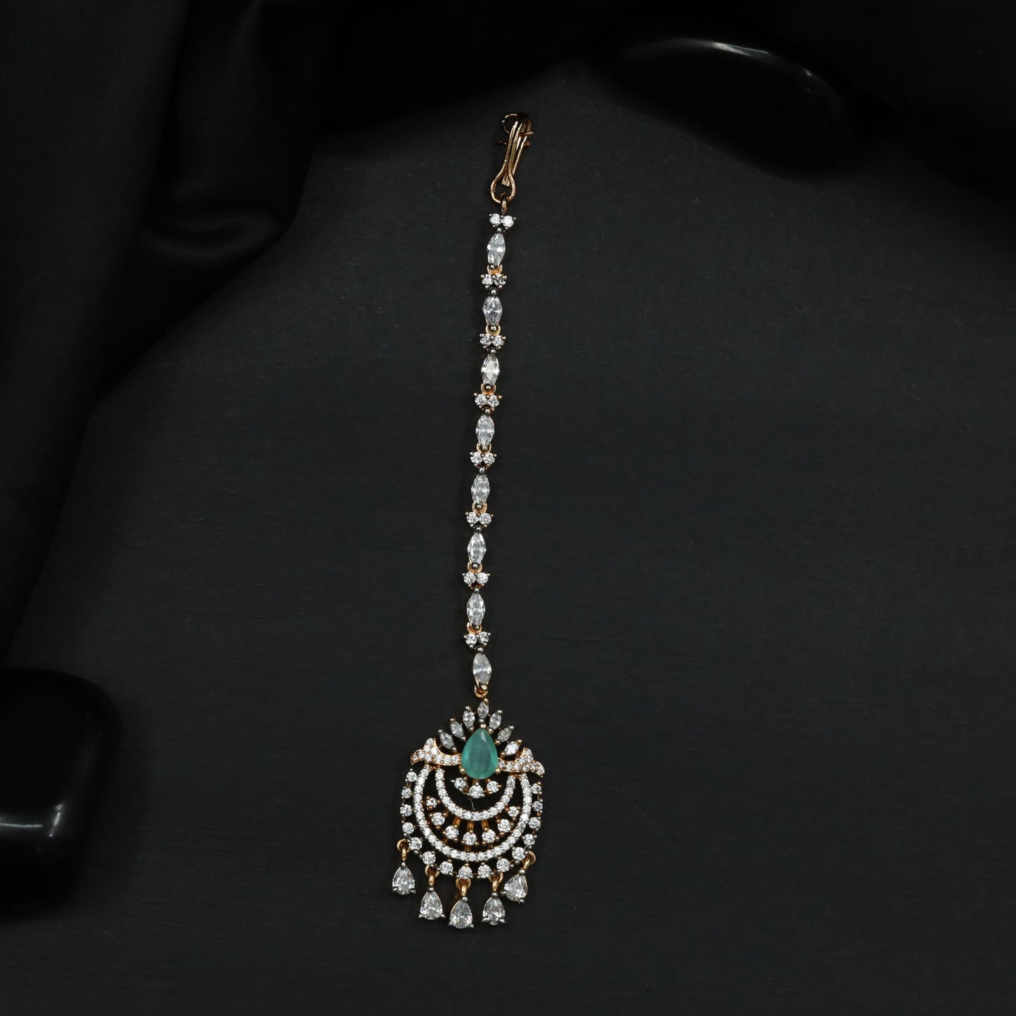 Tikka Featuring Decorative Crescent Pattern and Fringe Elements