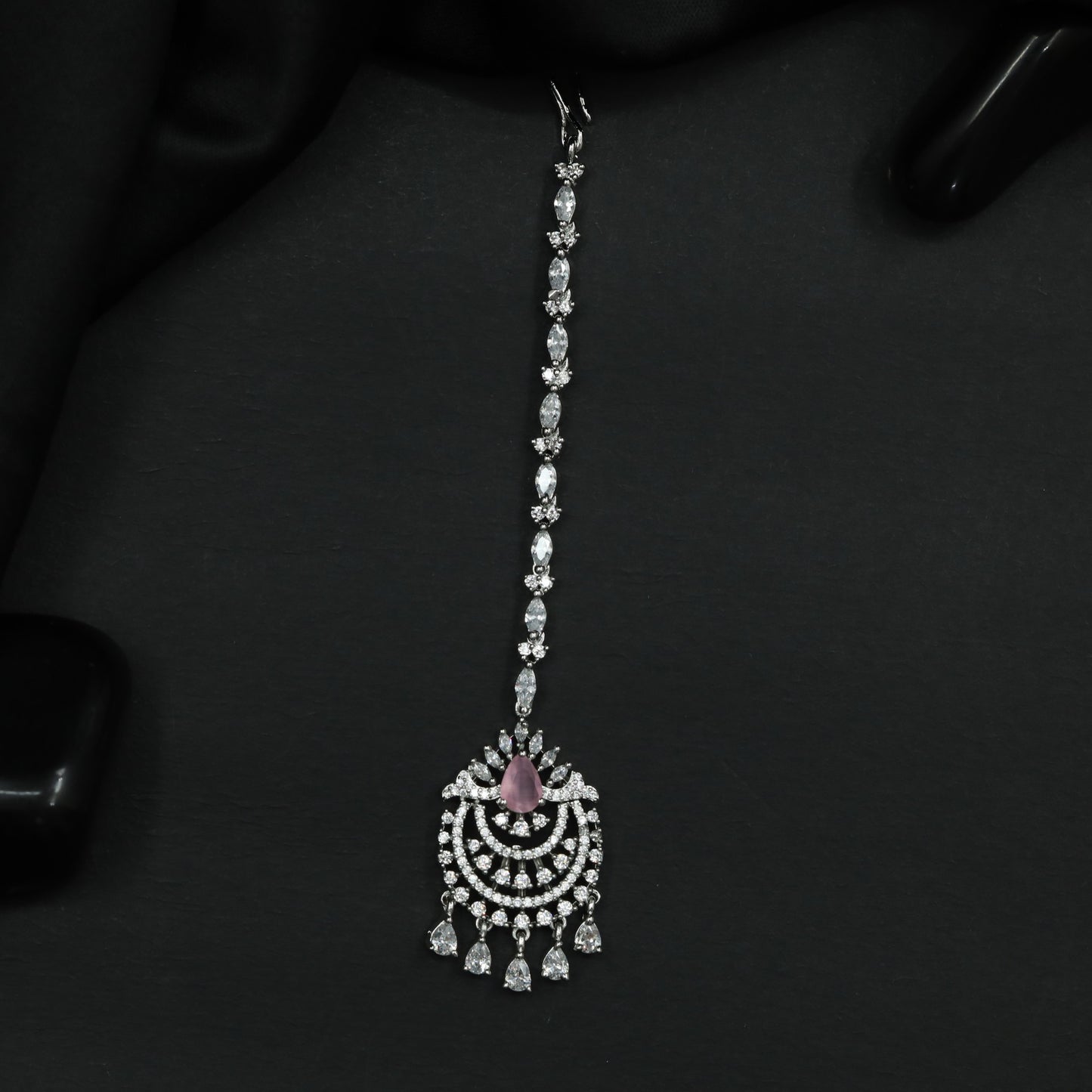 Tikka Featuring Decorative Crescent Pattern and Fringe Elements