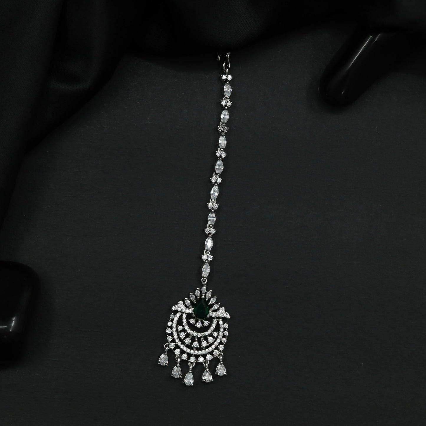Tikka Featuring Decorative Crescent Pattern and Fringe Elements