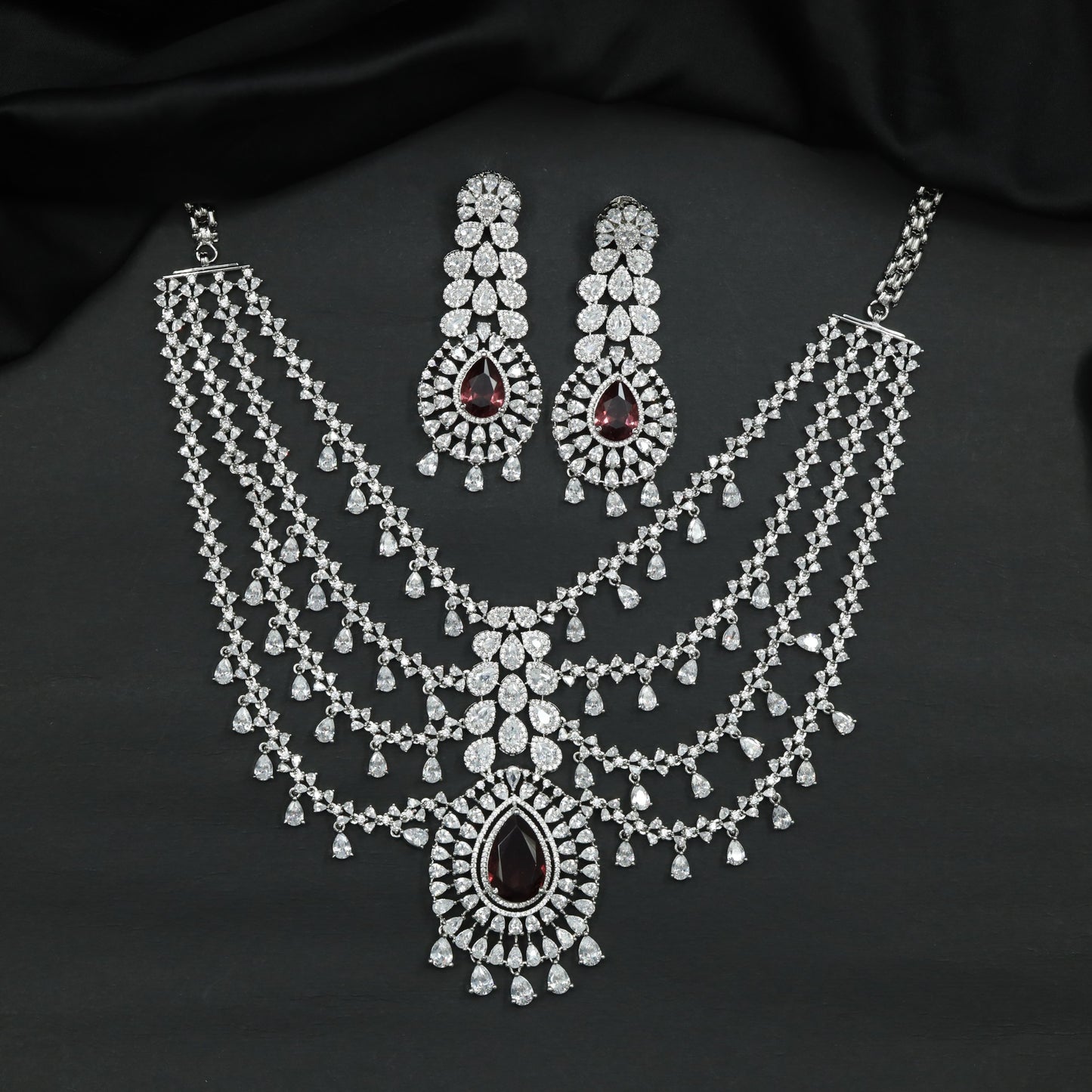 Rhodium Necklace with Layered Drape Pattern and Pendant Accent