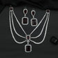 Rhodium Necklace Featuring Geometric Pendants and Triple Strand Construction