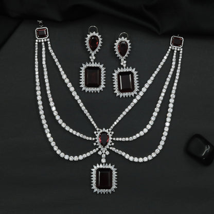 Rhodium Necklace Featuring Geometric Pendants and Triple Strand Construction