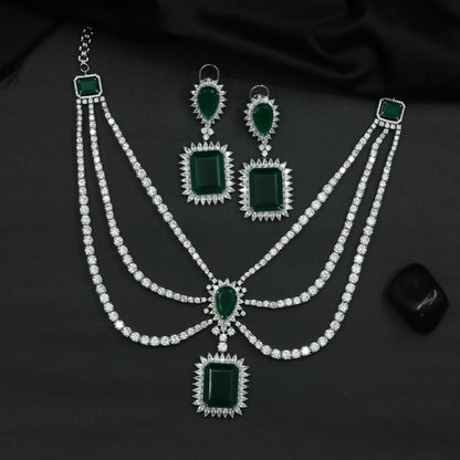 Rhodium Necklace Featuring Geometric Pendants and Triple Strand Construction