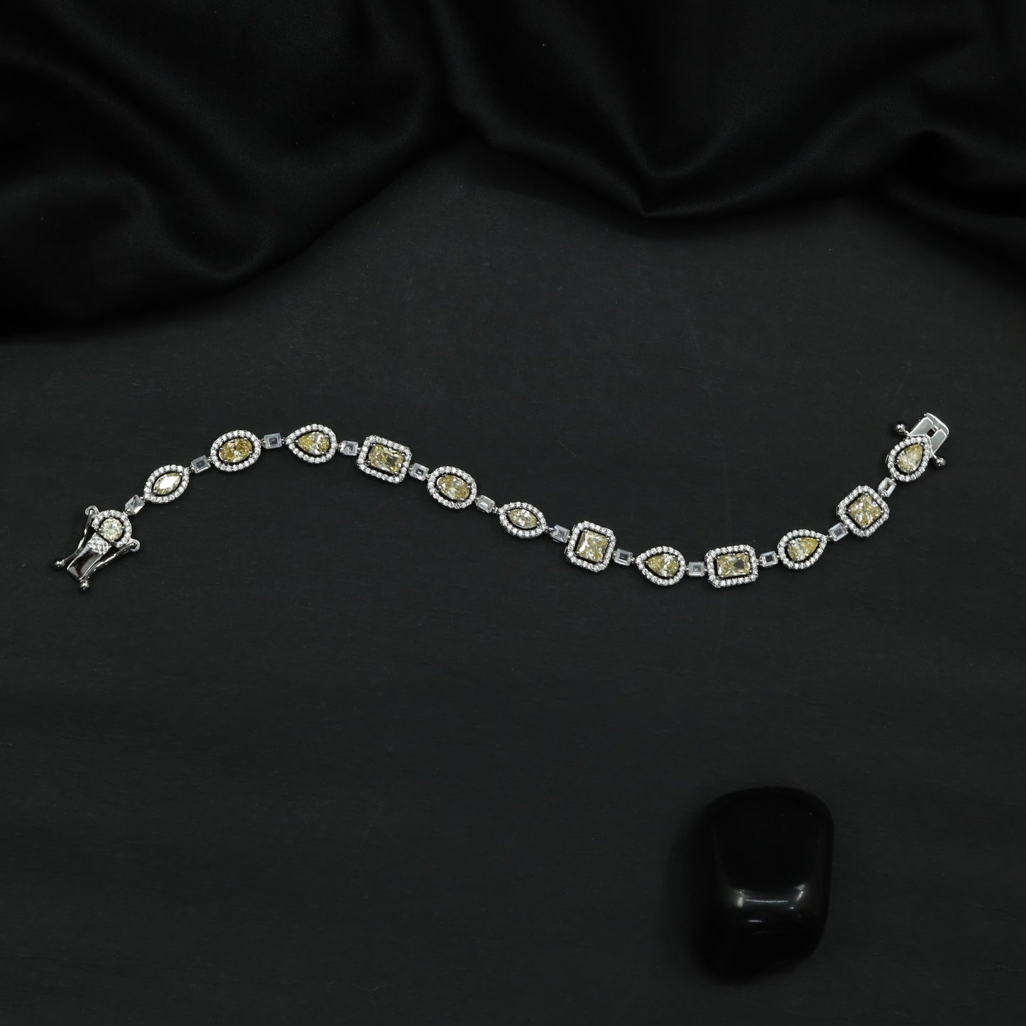 Rhodium Bracelet with Framed Cushion Links and Leaf Details