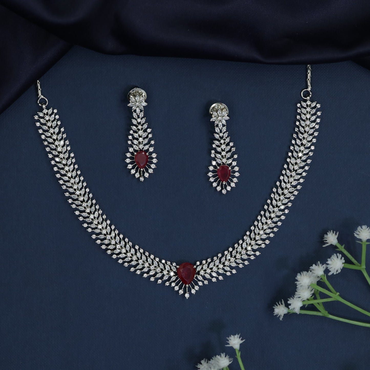 Statement Necklace with Layered Row Construction and Center Drop