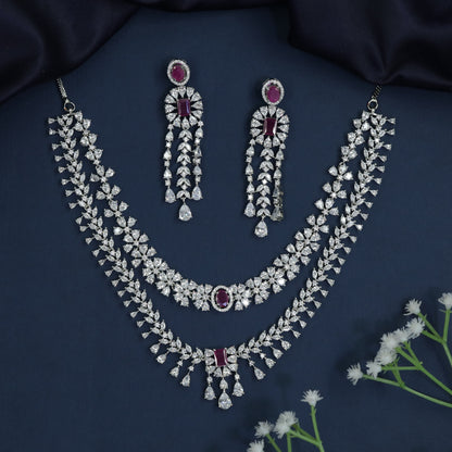 Rhodium necklace with draped collar styling and statement drop centerpiece