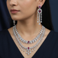 Rhodium necklace with draped collar styling and statement drop centerpiece