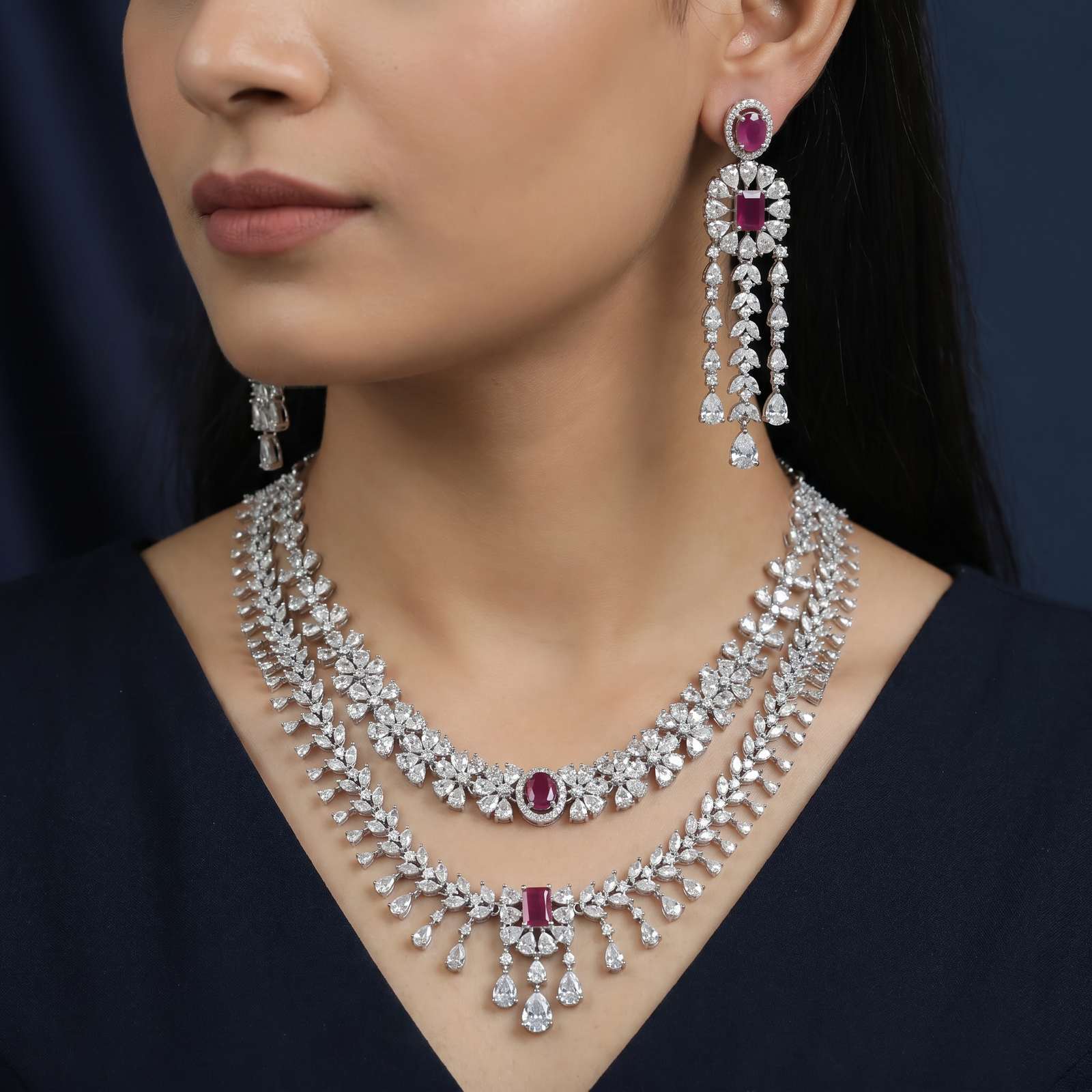 Rhodium necklace with draped collar styling and statement drop centerpiece