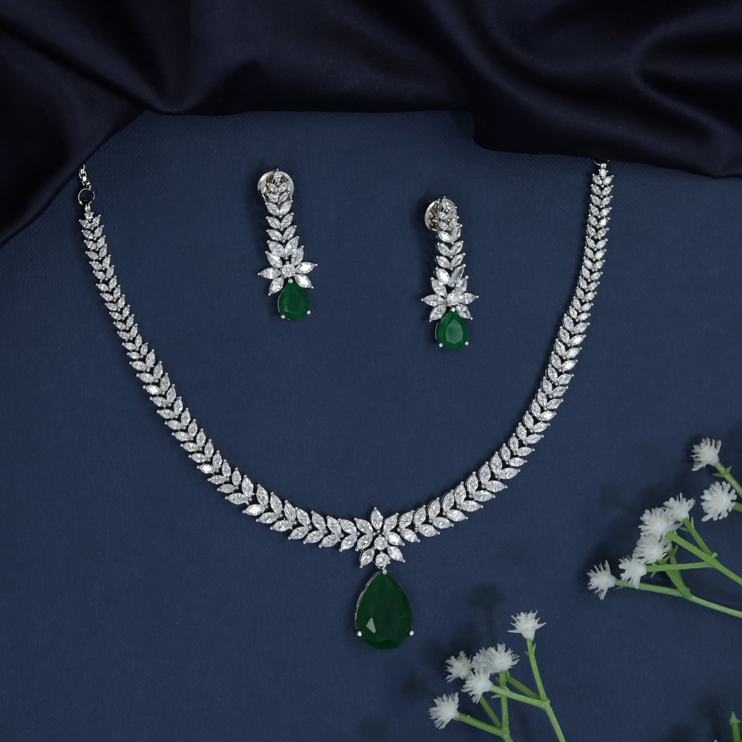 Rhodium necklace with tapered collar design and teardrop centerpiece