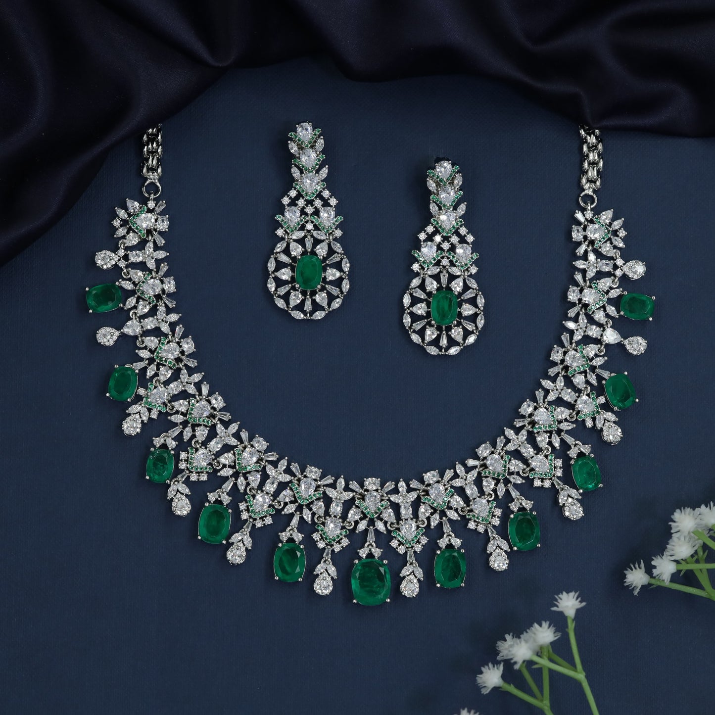 Floral halo rhodium necklace with cascading teardrop accents