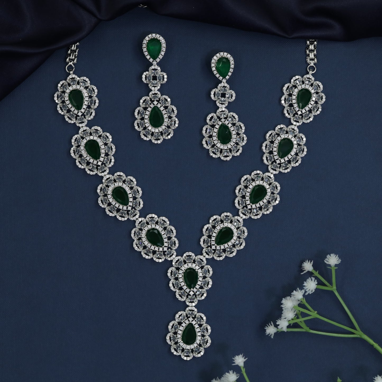 Rhodium necklace with scalloped halo stations and Y-drop silhouette
