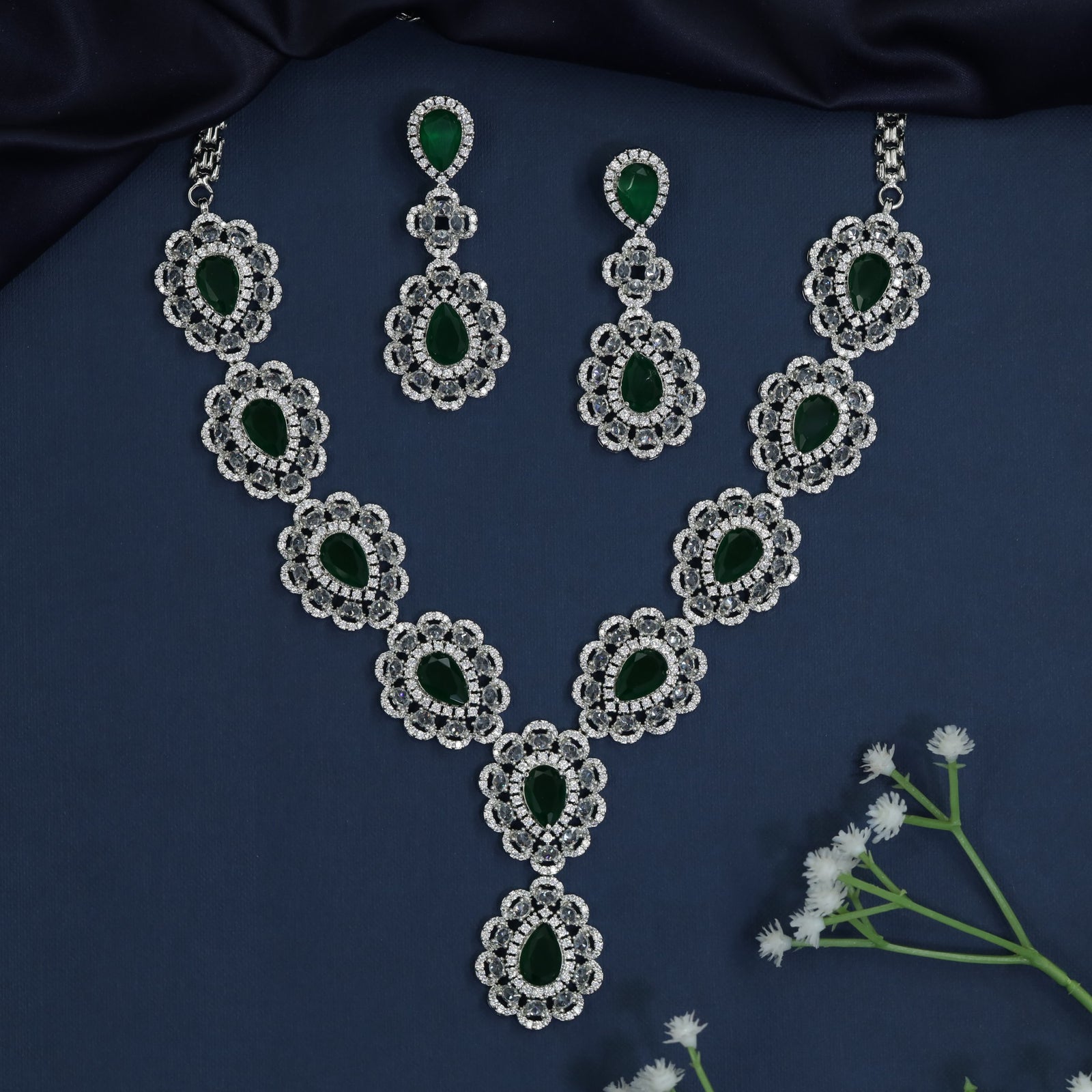 Rhodium necklace with scalloped halo stations and Y-drop silhouette