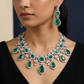 Statement rhodium necklace with daisy-inspired stations and teardrop accents
