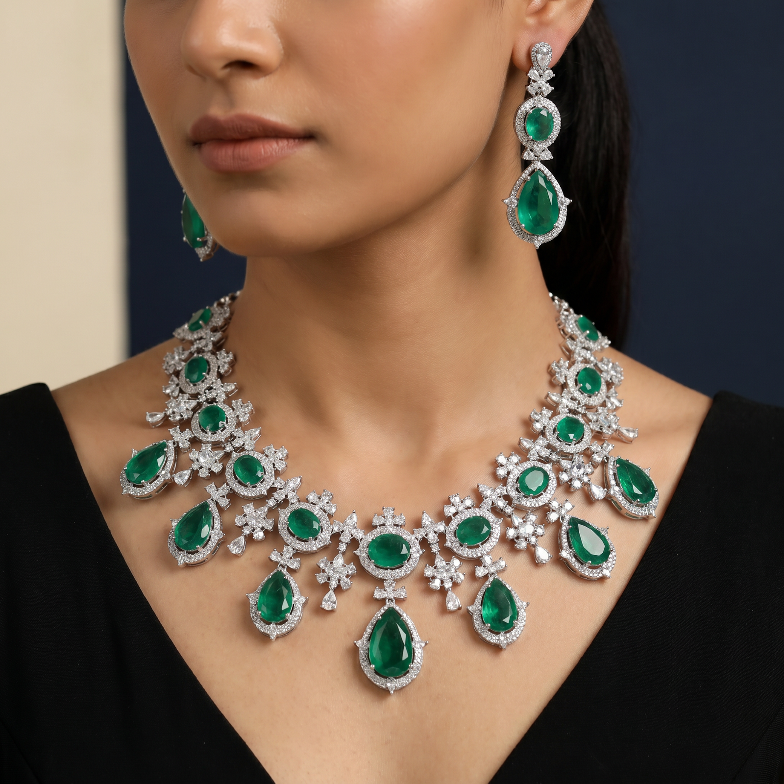 Statement rhodium necklace with daisy-inspired stations and teardrop accents