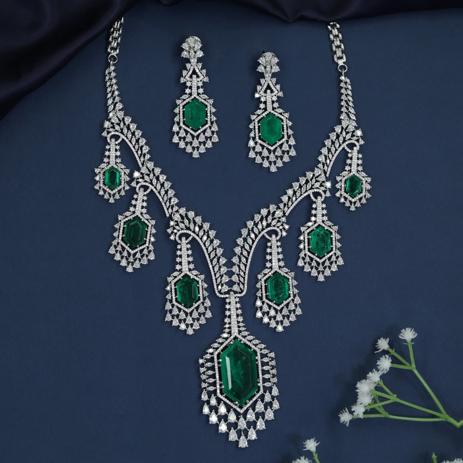 Rhodium necklace with chandelier drop silhouette and teardrop centerpiece